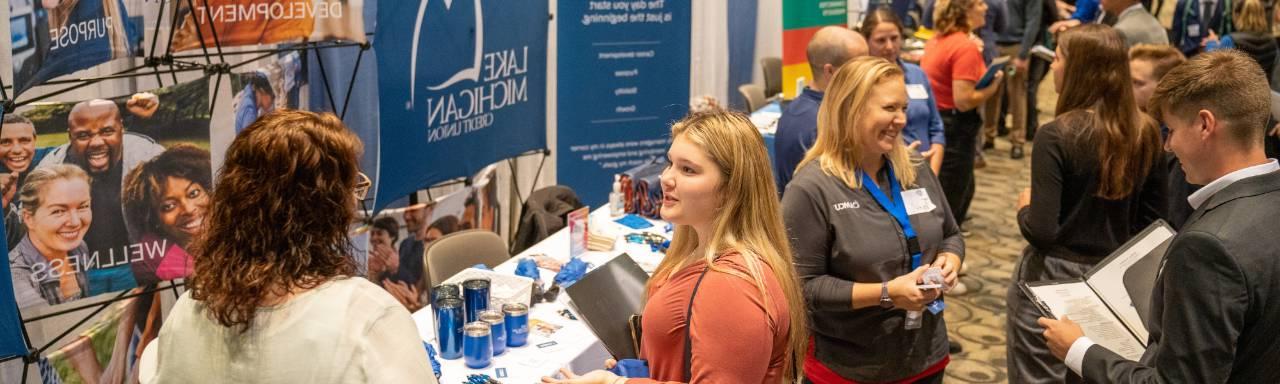 people talking at a career fair